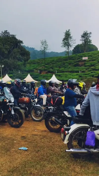 Motorcyclists at Wayanad Resort Motorcyclists lining up near the hills and event tents at boCHE 1000 Acre resort, a premier destination for adventure activities in Wayanad.