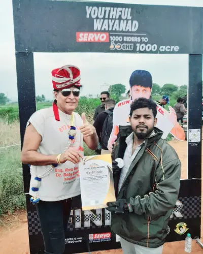 Kalam World Record Award Presentation Dr. Boby Chemmanur Boche receiving the Kalam’s World Records certificate for the biggest motorcycle convoy, with the banner of boCHE 1000 Acre, one of the top resorts in Wayanad for events.