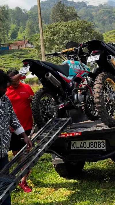 Off-Road Dirt Bikes at Wayanad Event Off road dirt bikes being prepared and unloaded from a transport truck via a ramp at boCHE 1000 Acre, a premier hub for adventure activities in Wayanad.