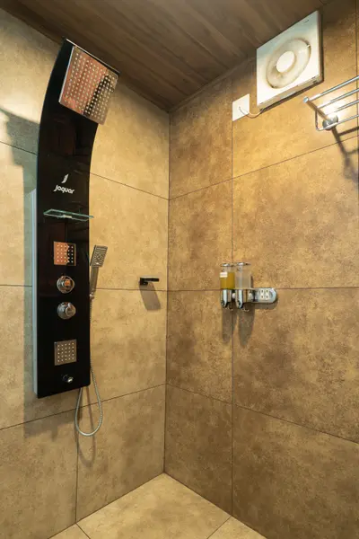 Contemporary bathroom featuring a luxury multi-function shower at boCHE 1000 Acre resort, perfect for a premium stay in Wayanad.