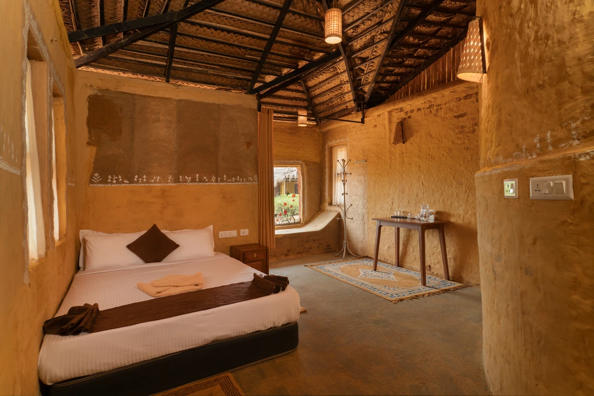 Mud House Rustic Wooden Bed Rustic wooden double bed and earthy decor in the mud house wayanad rooms