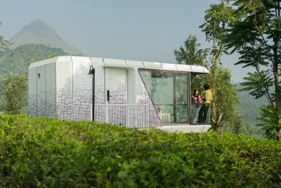 Futuristic xpod wayanad villa exterior with glass front at boCHE 1000 Acres resort in wayanad