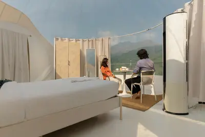 Luxury climate-controlled bedroom setup inside transparent bubble dome wayanad