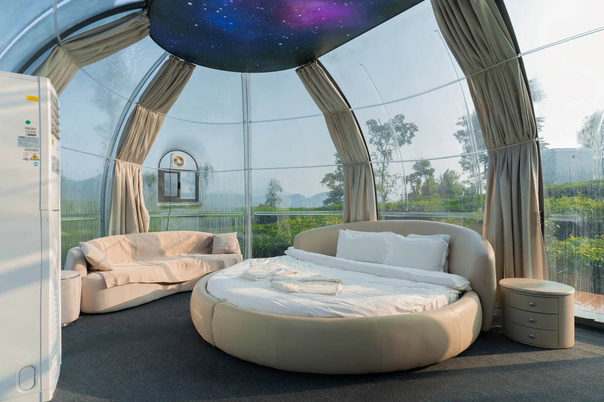 Intimate Bedroom in Dome Room Luxury double bed and intimate atmosphere inside the dome rooms at wayanad