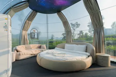 Luxury double bed and intimate atmosphere inside the dome rooms at wayanad