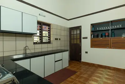 Fully equipped modern kitchen inside Mountain Residence, perfect for wayanad resort packages