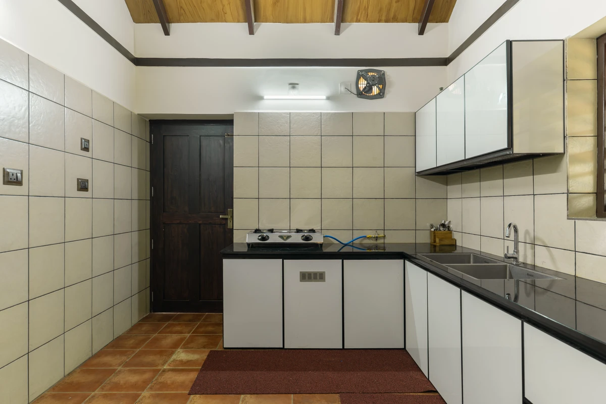 Fully equipped modern kitchen inside Mountain Residence, perfect for wayanad resort packages