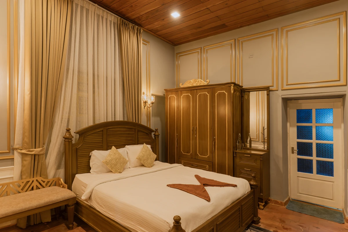 Colonial Decor inside British Bungalow Traditional wooden furniture and colonial decor inside british bungalow wayanad rooms