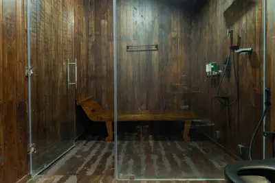 Premium bedroom bathroom suite at boCHE 1000 Acres, one of the best resorts in wayanad