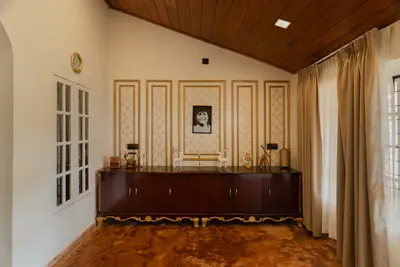 Sunlit reading corner inside the private suite of british bungalow wayanad