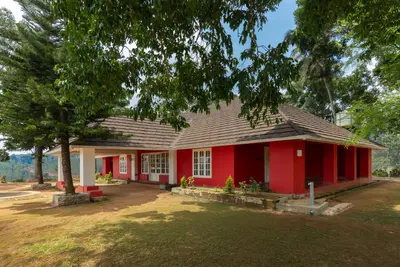 Charming premium bungalow exterior at boCHE 1000 Acre resort, offering a peaceful stay in Wayanad.