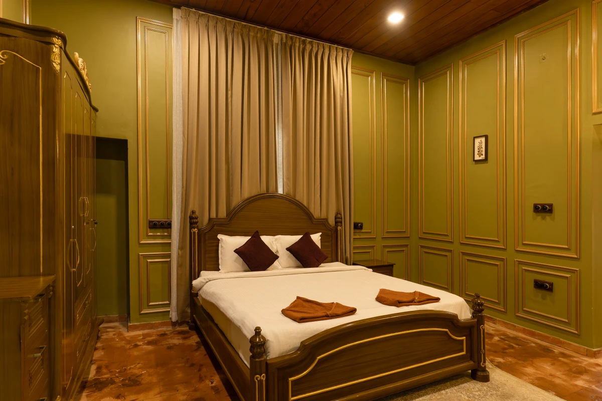 Royal Villa Bedroom Setup Luxurious royal-themed villa bedroom at boCHE 1000 Acre resort, offering a premium stay in Wayanad