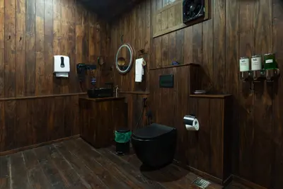 Premium cabin bathroom interior at boCHE 1000 Acre resort, offering a luxury stay in Wayanad.